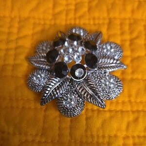 Elegant Silver and Black Floral Brooch